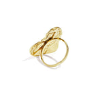 Gold ring with a unique design on a white background