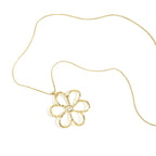 Gold flower-shaped pendant on a chain against a white background
