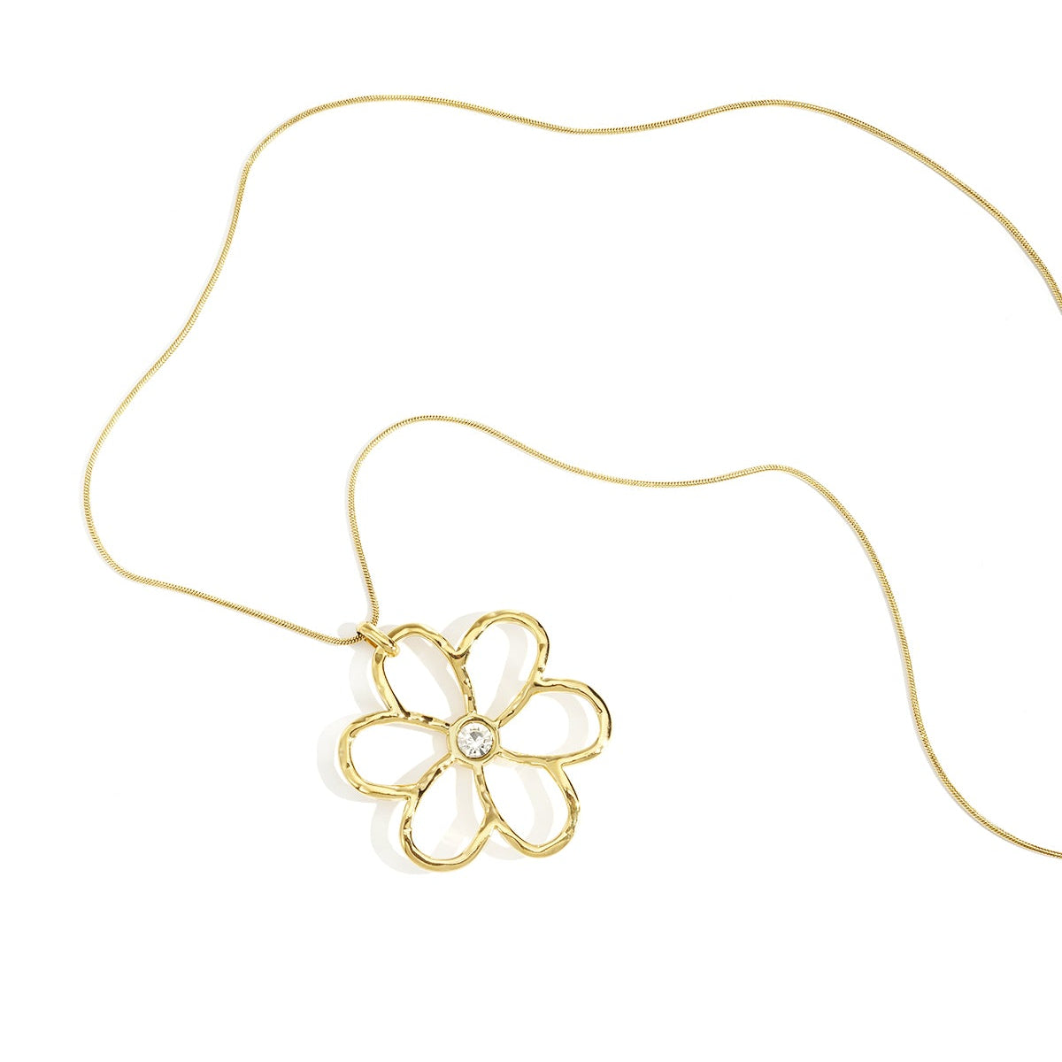 Gold flower-shaped pendant on a chain against a white background