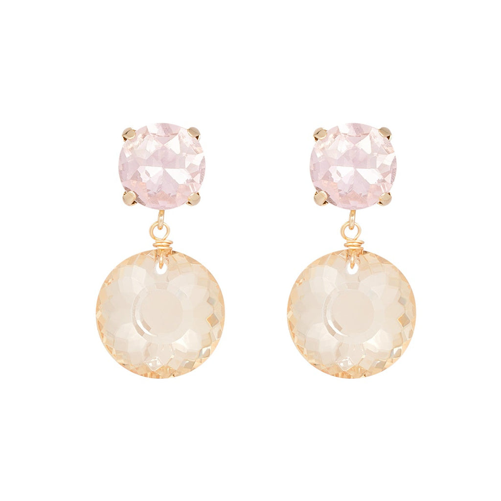 Pair of earrings with pink and beige stones on a white background