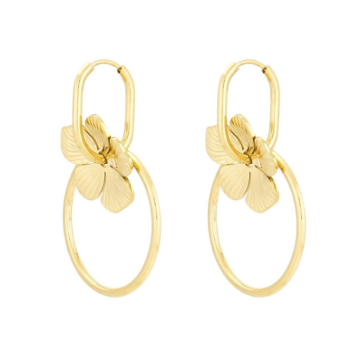 Gold earrings with circular designs on a white background