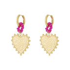 Gold heart-shaped earrings with pink floral elements on a white background