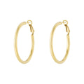 Gold hoop earrings on a white background