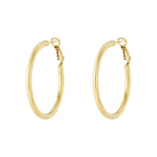 Gold hoop earrings on a white background