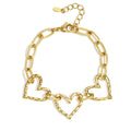 Gold chain bracelet with heart-shaped links on a white background