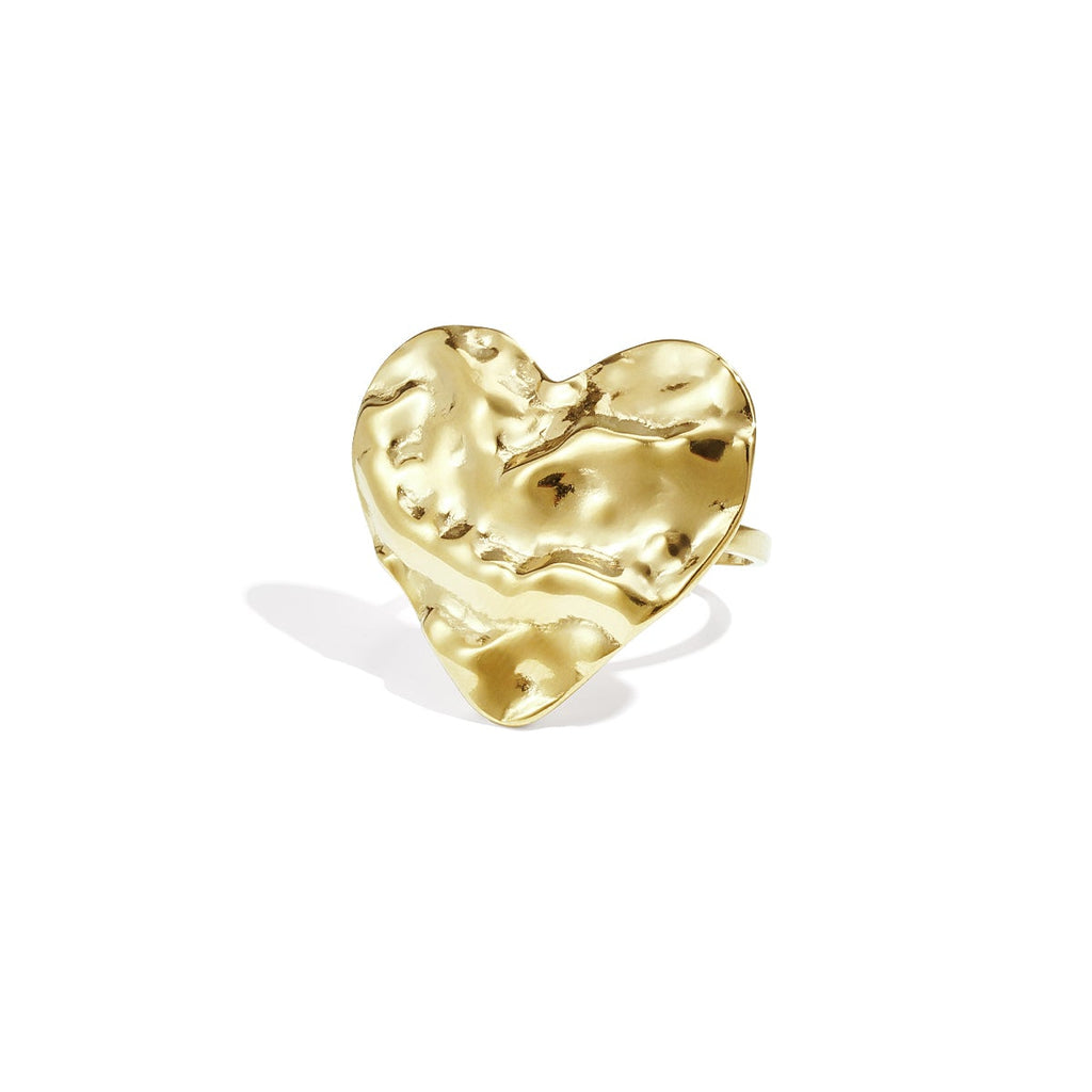 Gold heart-shaped earring on a white background