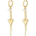 Gold heart-shaped earrings with chain details on a white background