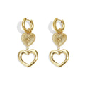 Gold heart-shaped earrings on a white background