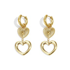 Gold heart-shaped earrings on a white background