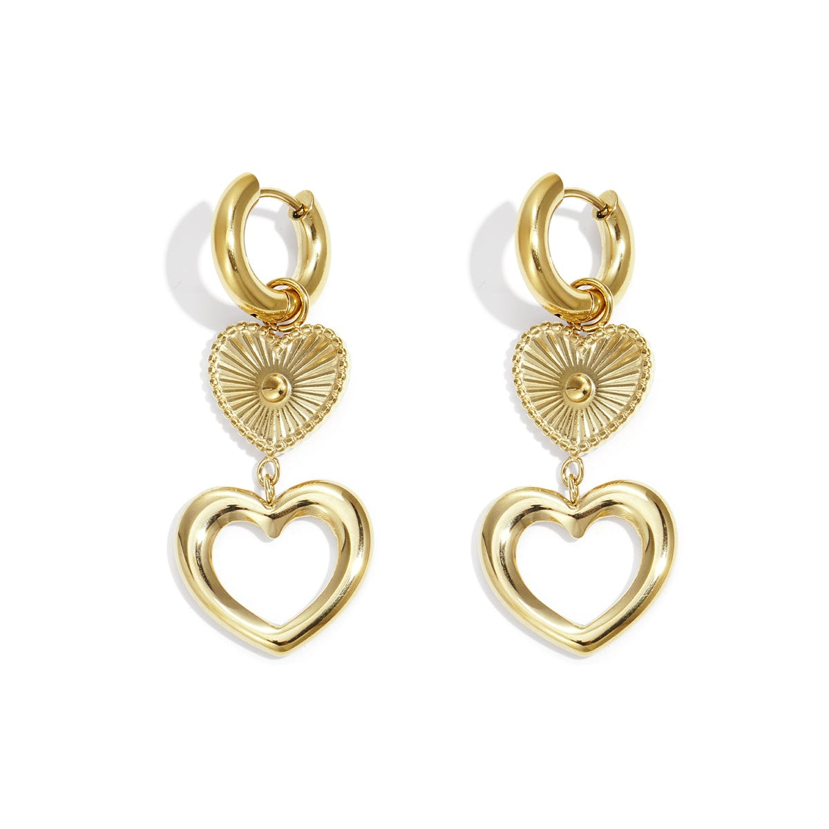Gold heart-shaped earrings on a white background